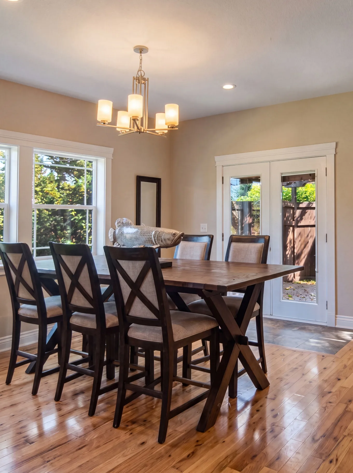 Dining room renovation with hardwood floors by Premier Building & Construction